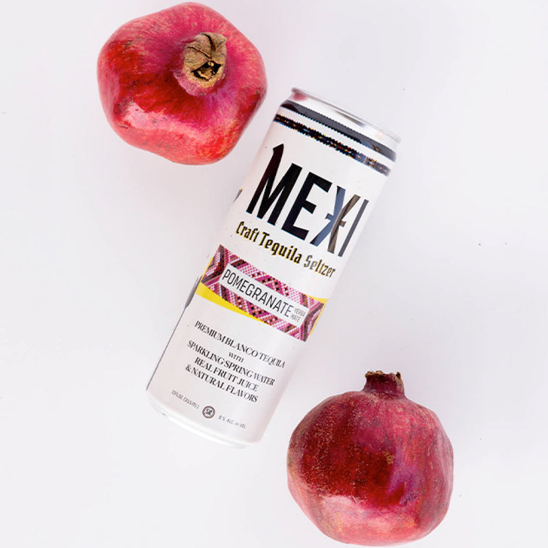 Pomengranates and a can of Pomegranate Yerba Mate Mexi Seltzer
